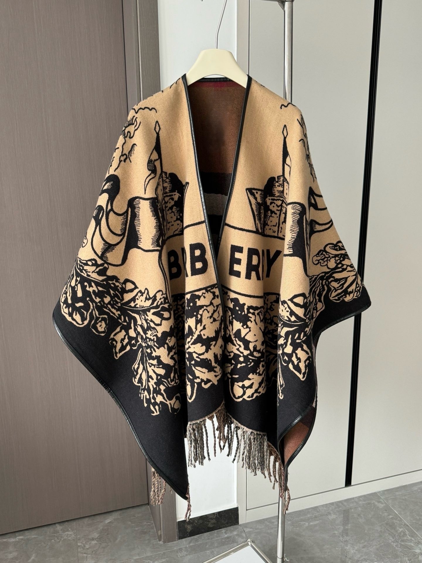 Oversized Knitted Wool Cape with Tassels