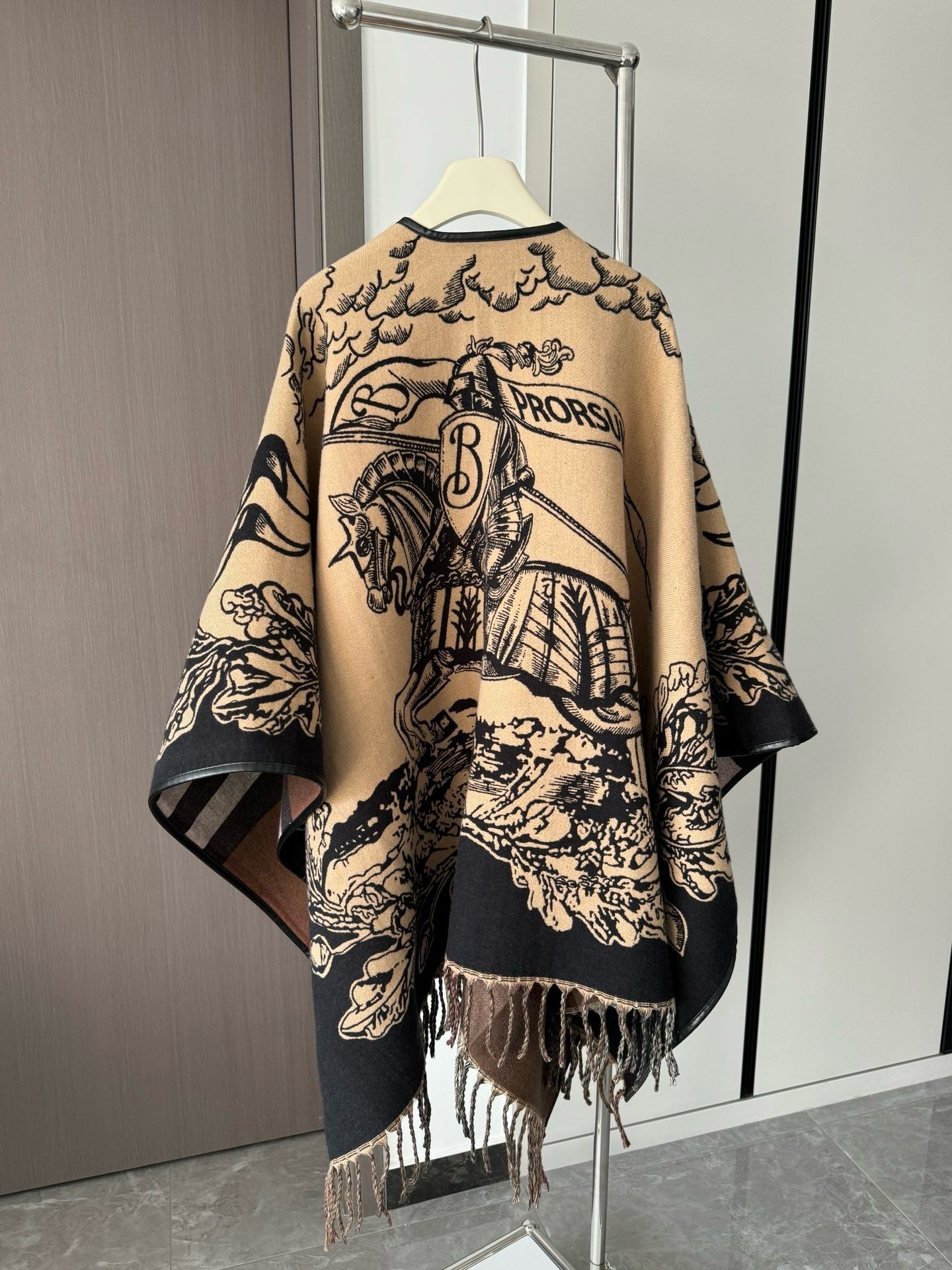 Oversized Knitted Wool Cape with Tassels